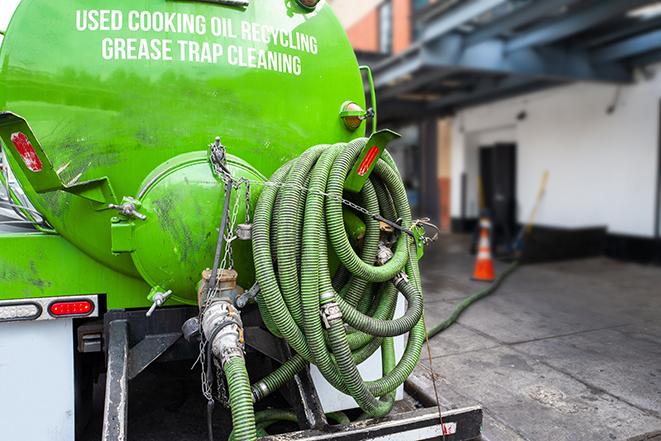 large truck pumping grease trap at a restaurant in Belfair WA